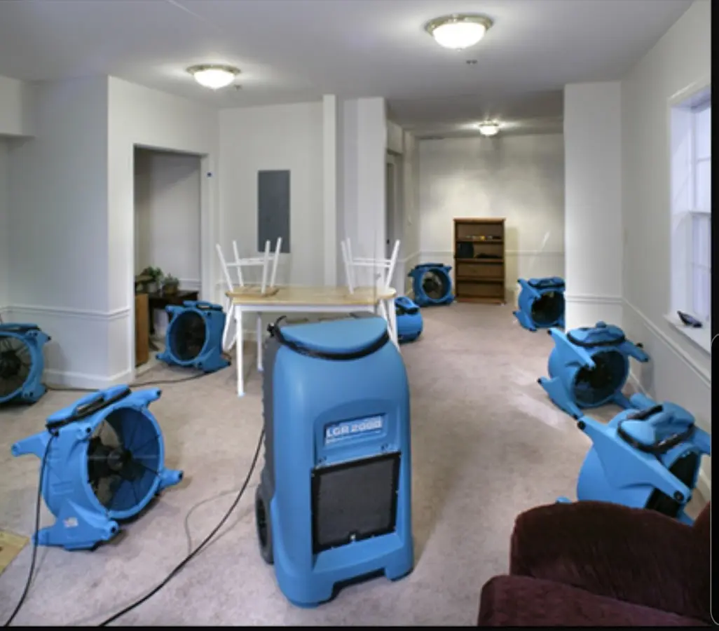 Air movers and dehumidifier setup for Water Damage Restoration in New London